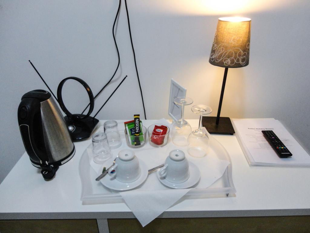 Casa de hóspedes Suites Holiday Rooms *